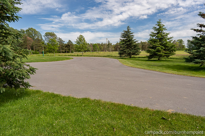 Campsite Photo of Site 8 at Burnham Point State Park, New York - Looking Back Towards Road