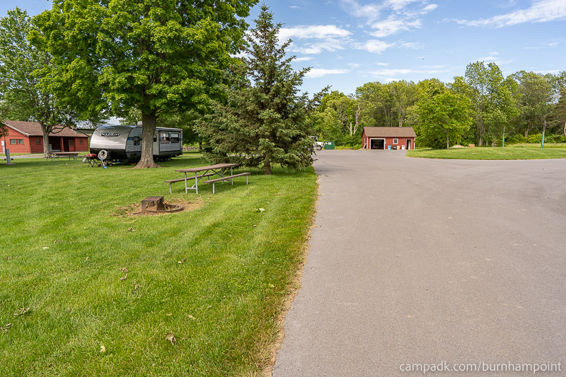 Campsite Photo of Site 8 at Burnham Point State Park, New York - View Down Road from Campsite