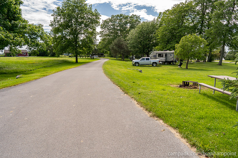 Campsite Photo of Site 8 at Burnham Point State Park, New York - View Down Road from Campsite