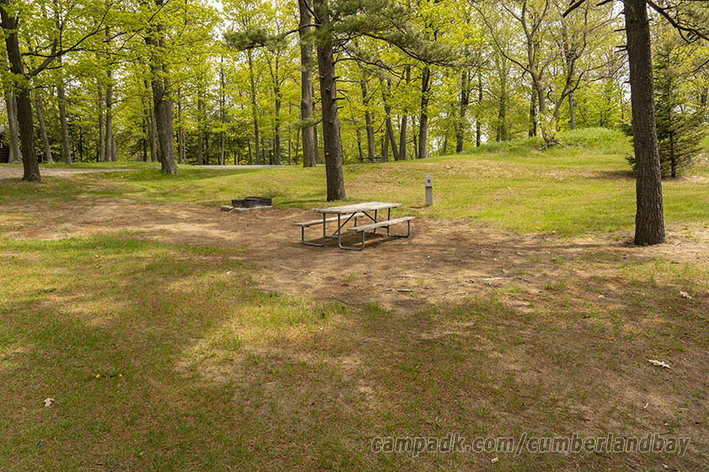 Campsite Photo of Site 39 at Cumberland Bay State Park, New York - Looking at Site from Road Sign Visible