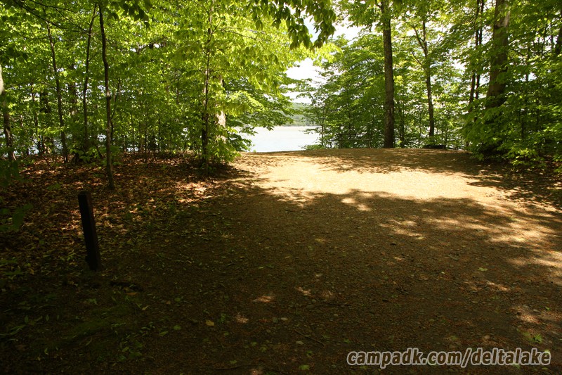 Campsite Photo of Site 92 at Delta Lake State Park, New York - Looking at Site from Road Sign Visible