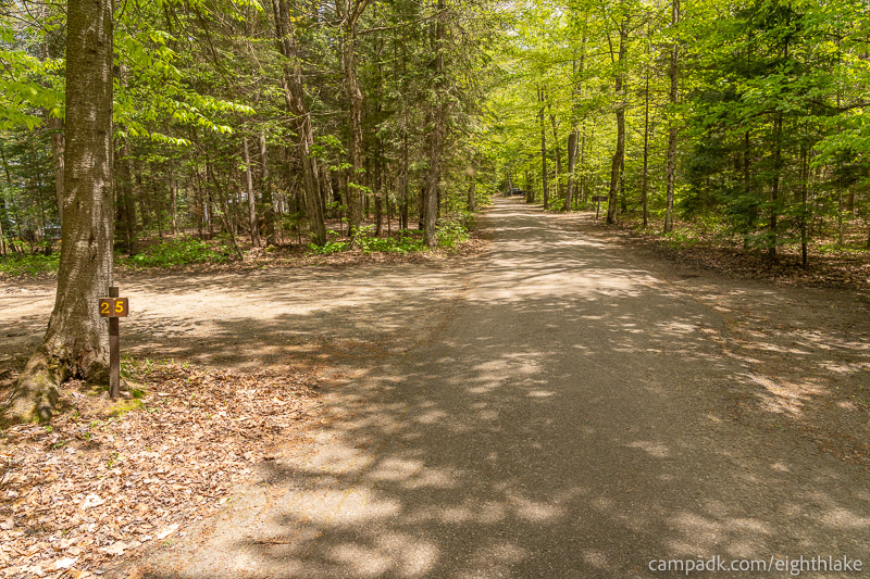 Campsite Photo of Site 25 at Eighth Lake Campground, New York - View Down Road from Campsite