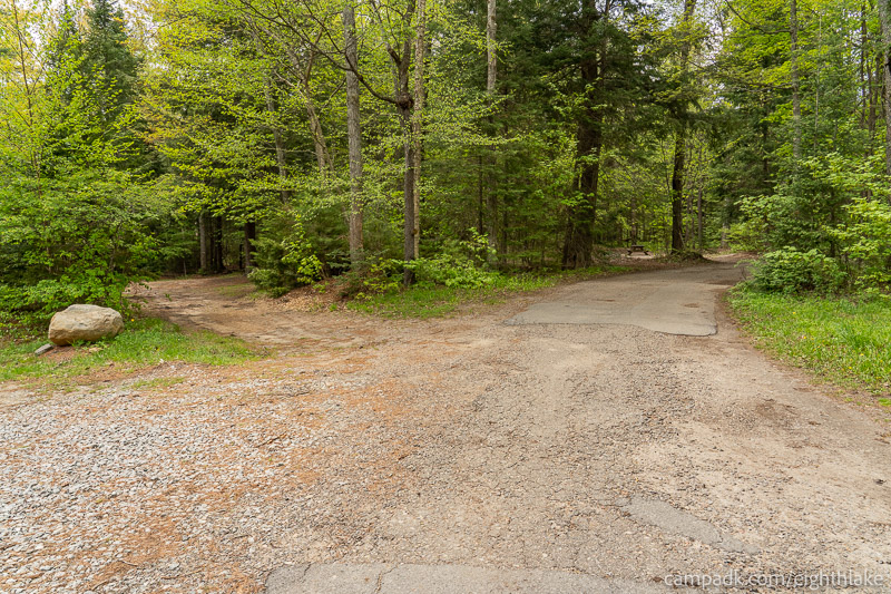Campsite Photo of Site 112 at Eighth Lake Campground, New York - View Down Road from Campsite