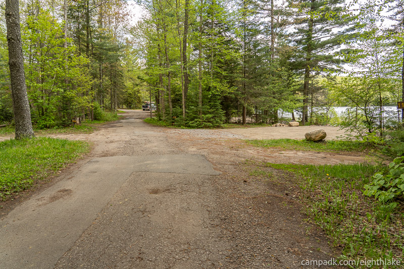 Campsite Photo of Site 112 at Eighth Lake Campground, New York - View Down Road from Campsite