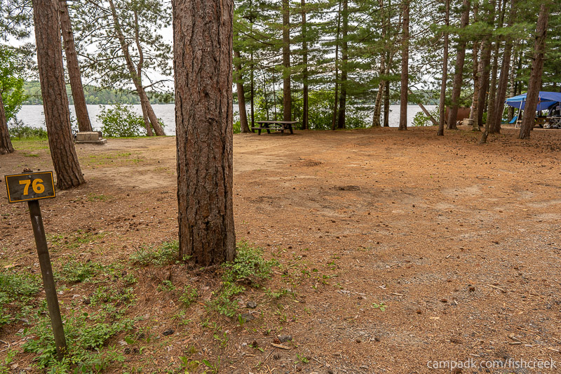 Campsite Photo of Site 106 at Fish Creek Pond Campground, New York - Looking at Site from Road Sign Visible
