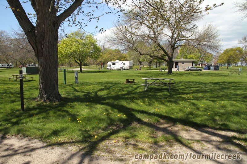 Campsite Photo of Site 8 at Four Mile Creek State Park, New York - Looking at Site from Road Sign Visible