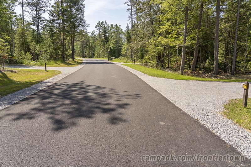 Campsite Photo of Site T65 at Frontier Town Campground, New York - View Down Road from Campsite