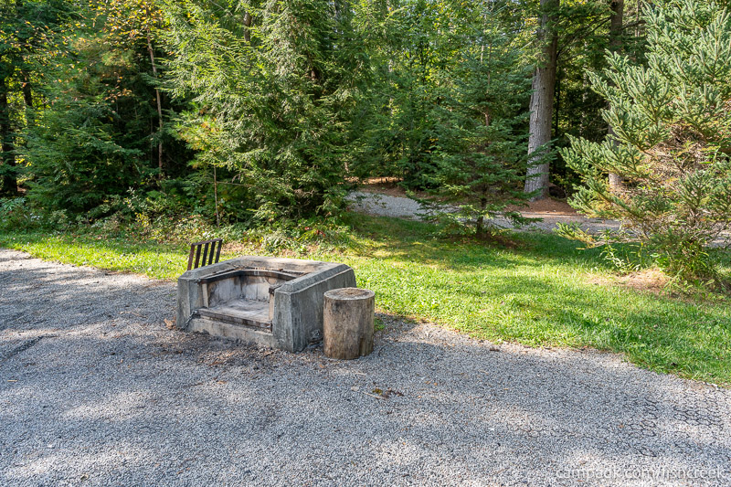 Campsite Photo of Site T65 at Frontier Town Campground, New York - Fireplace View