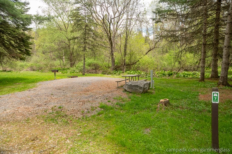 Campsite Photo of Site 7 at Glimmerglass State Park, New York - Looking at Site from Road Sign Visible