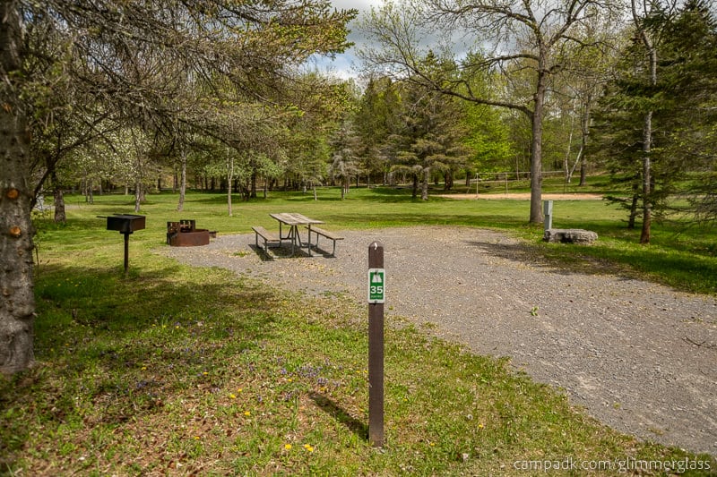 Campsite Photo of Site 35 at Glimmerglass State Park, New York - Looking at Site from Road Sign Visible