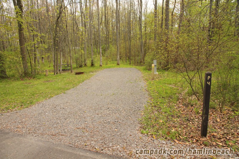 Campsite Photo of Site 4 at Hamlin Beach State Park, New York - Looking at Site from Road Sign Visible