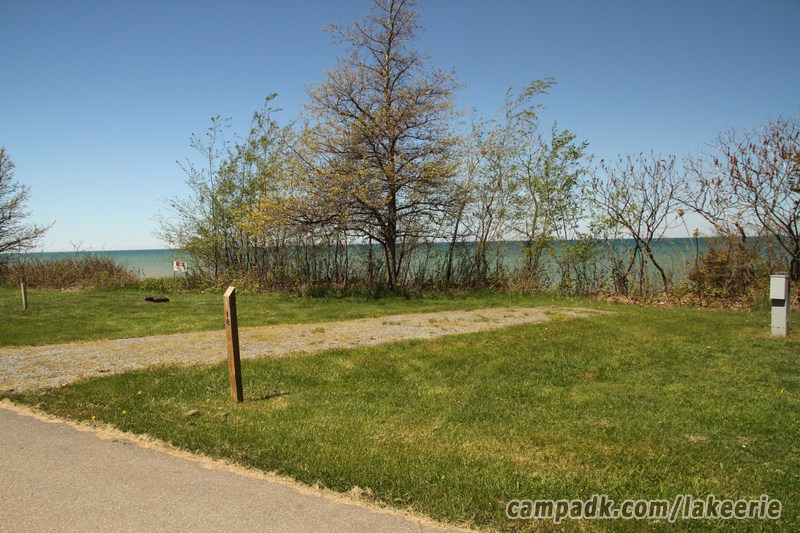 Campsite Photo of Site 18 at Lake Erie State Park, New York - Looking at Site from Road Sign Visible