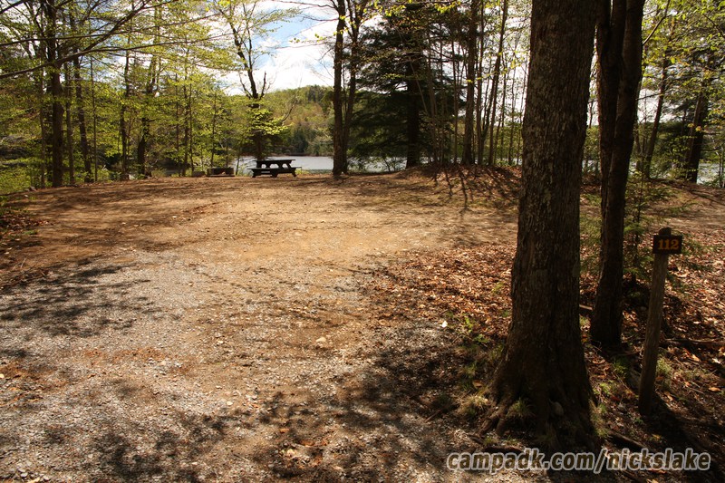 Campsite Photo of Site 112 at Nicks Lake Campground, New York - Looking at Site from Road Sign Visible
