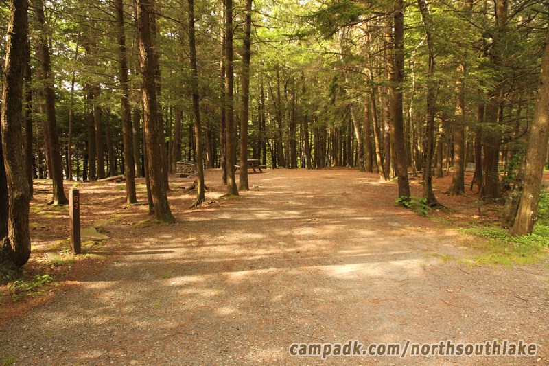 Campsite Photo of Site 63 at North South Lake Campground, New York - Looking at Site from Road Sign Visible