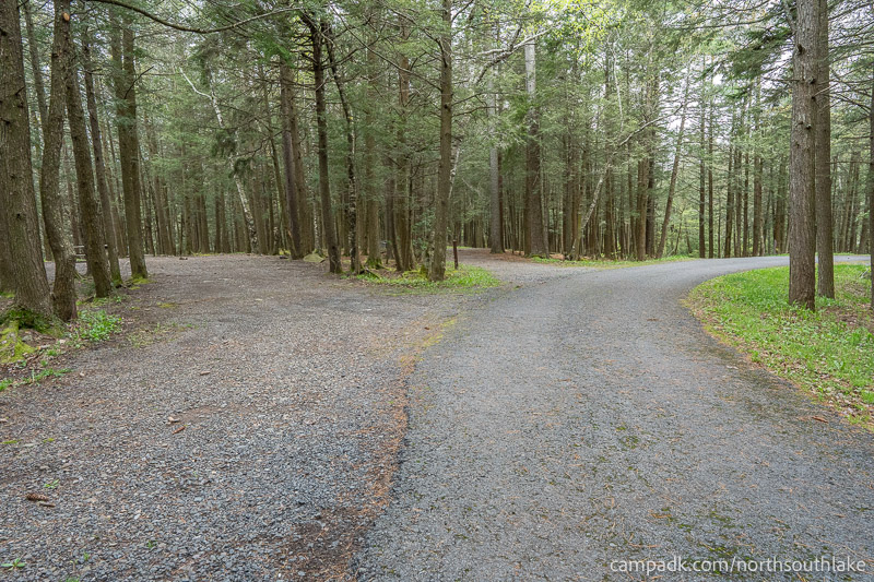 Campsite Photo of Site 63 at North South Lake Campground, New York - View Down Road from Campsite