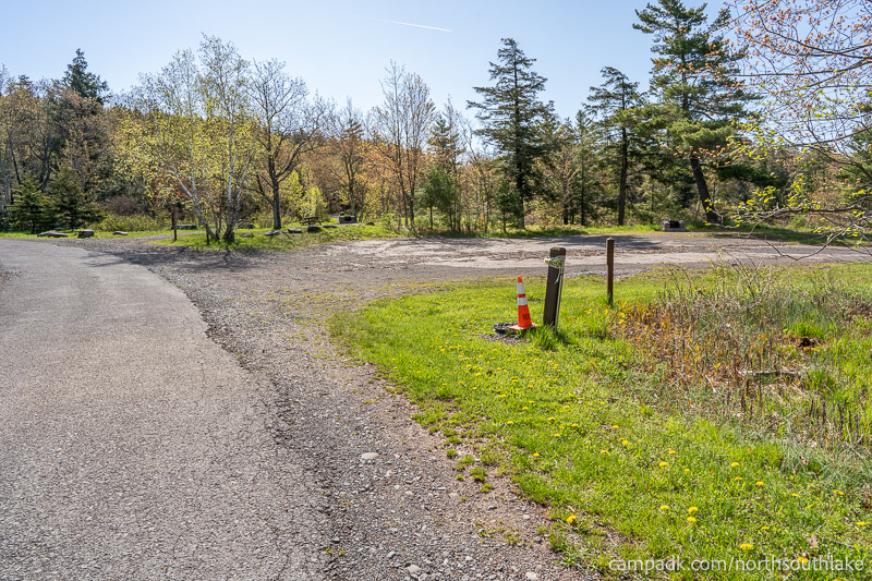 Campsite Photo of Site 150 at North South Lake Campground, New York - View Down Road from Campsite