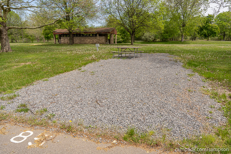 Campsite Photo of Site 85 at Sampson State Park, New York - Looking at Site from Road Sign Visible