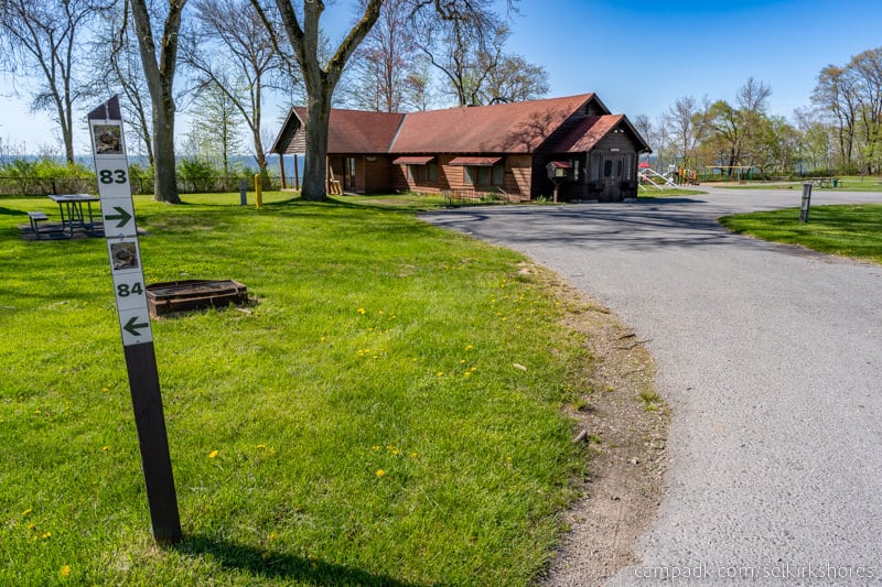 Campsite Photo of Site 83 at Selkirk Shores State Park, New York - Looking at Site from Road Sign Visible