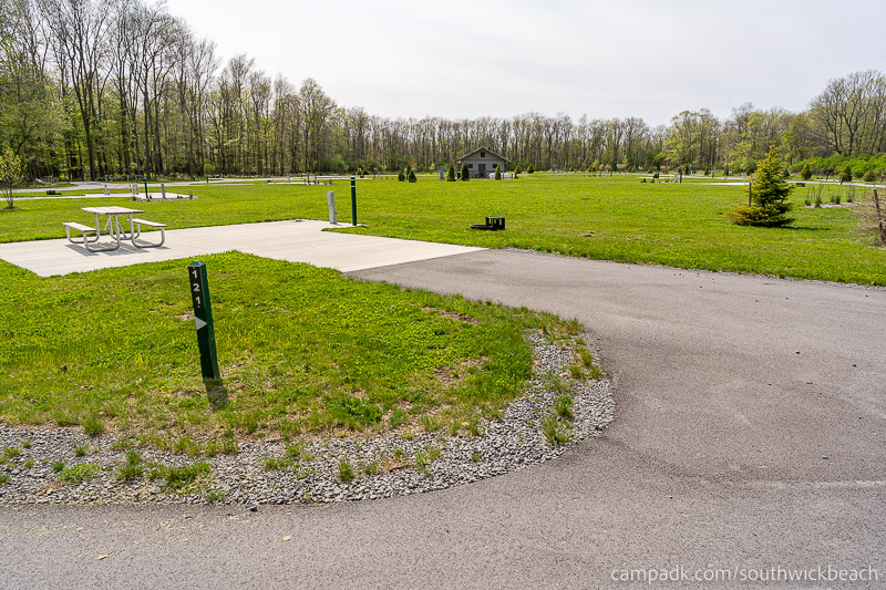 Campsite Photo of Site 121 at Southwick Beach State Park, New York - Looking at Site from Road Sign Visible
