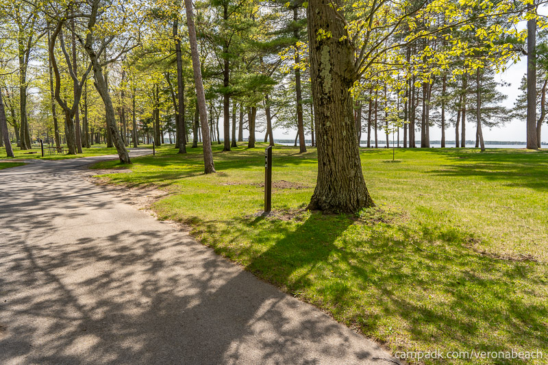 Campsite Photo of Site 9 at Verona Beach State Park, New York - View Down Road from Campsite