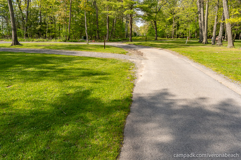 Campsite Photo of Site 32 at Verona Beach State Park, New York - View Down Road from Campsite