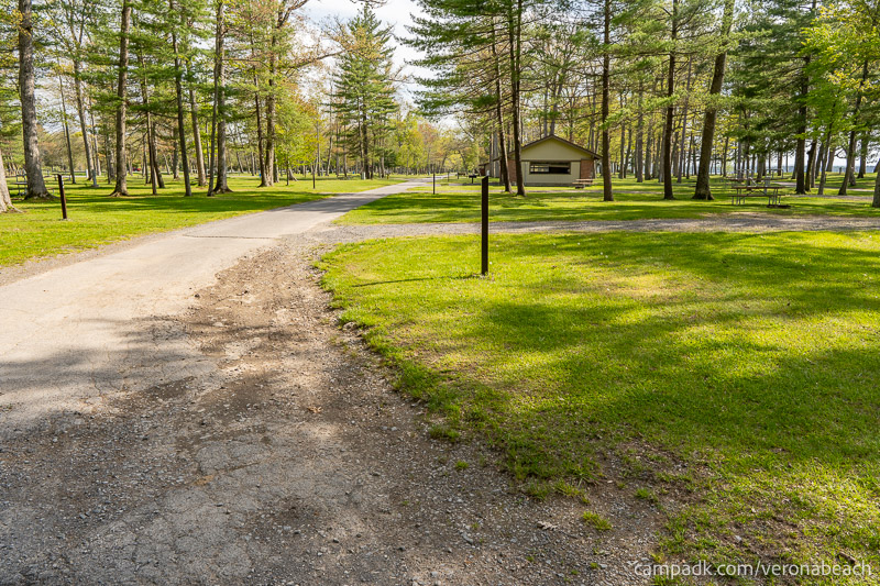 Campsite Photo of Site 32 at Verona Beach State Park, New York - View Down Road from Campsite