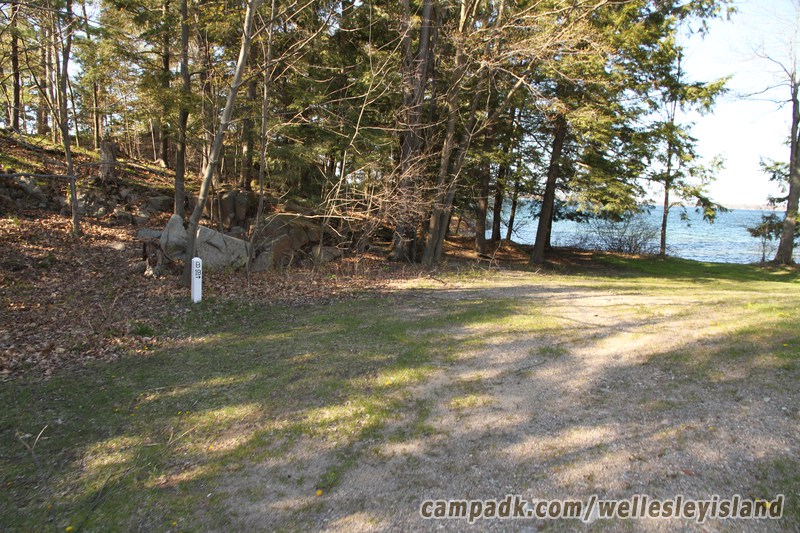 Campsite Photo of Site 19 at Wellesley Island State Park, New York - Looking at Site from Road Sign Visible
