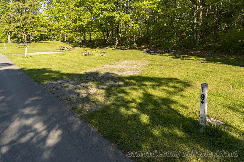 Campsite Photo of Site 19 at Wellesley Island State Park, New York - Looking at Site from Road Sign Visible