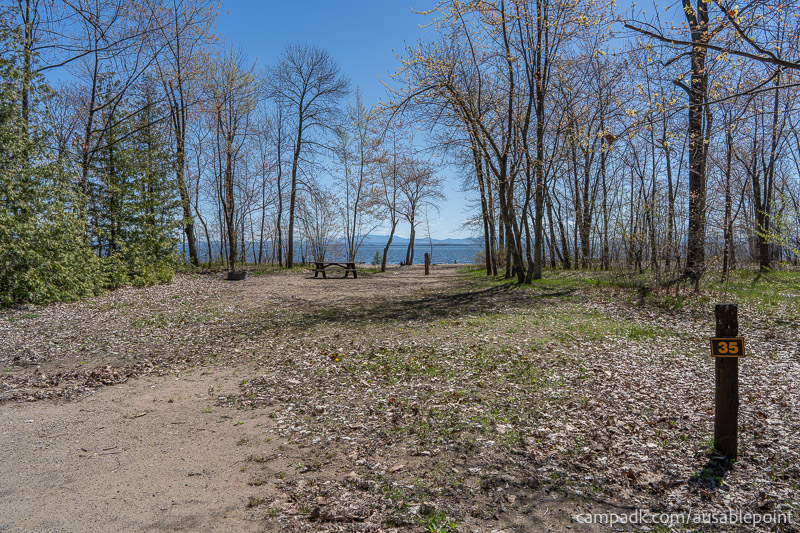 Campsite Photo of Site 35 at Ausable Point Campground, New York - Looking at Site from Road Sign Visible