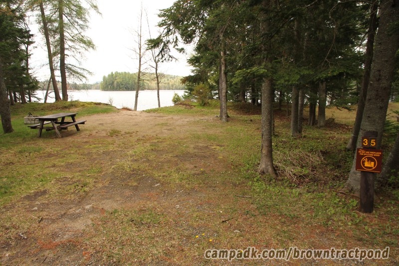 Campsite Photo of Site 35 at Brown Tract Pond Campground, New York - Looking at Site from Road Sign Visible