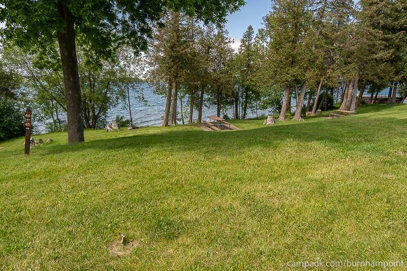 Campsite Photo of Site 45 at Burnham Point State Park, New York - Looking at Site from Road Sign Visible