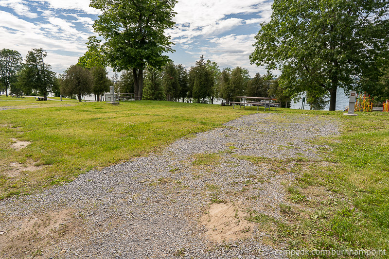 Campsite Photo of Site 25 at Burnham Point State Park, New York - Looking at Site from Road Sign Visible