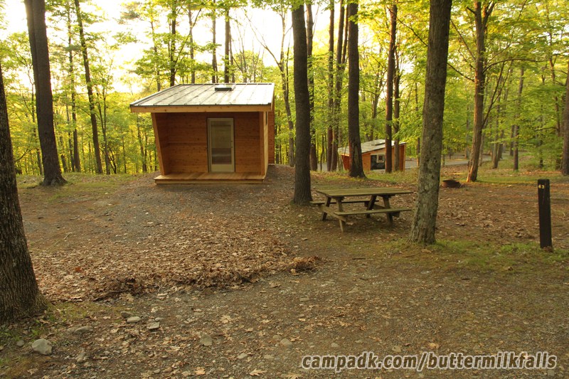 Campsite Photo of Site 43 at Buttermilk Falls State Park, New York - Looking at Site from Road Sign Visible