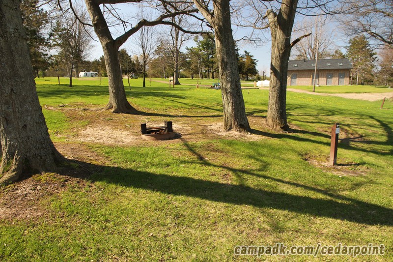 Campsite Photo of Site 114 at Cedar Point State Park, New York - Looking at Site from Road Sign Visible