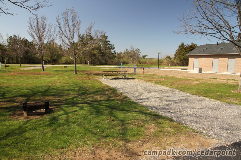 Campsite Photo of Site 154 at Cedar Point State Park, New York - Looking at Site from Road Sign Visible