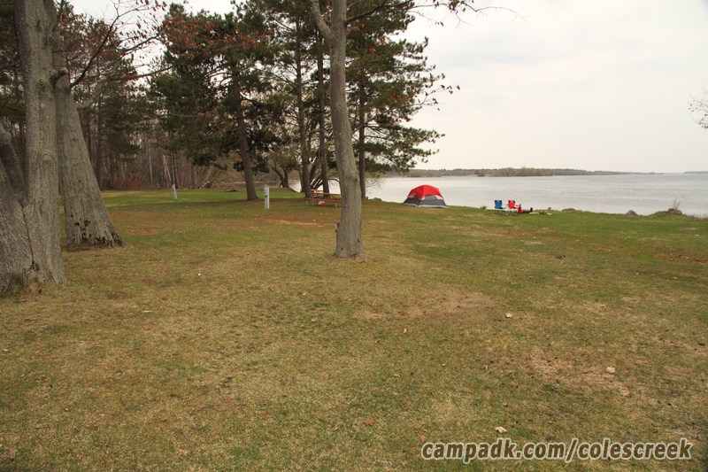 Campsite Photo of Site 82 at Coles Creek State Park, New York - Looking at Site from Road Sign Visible
