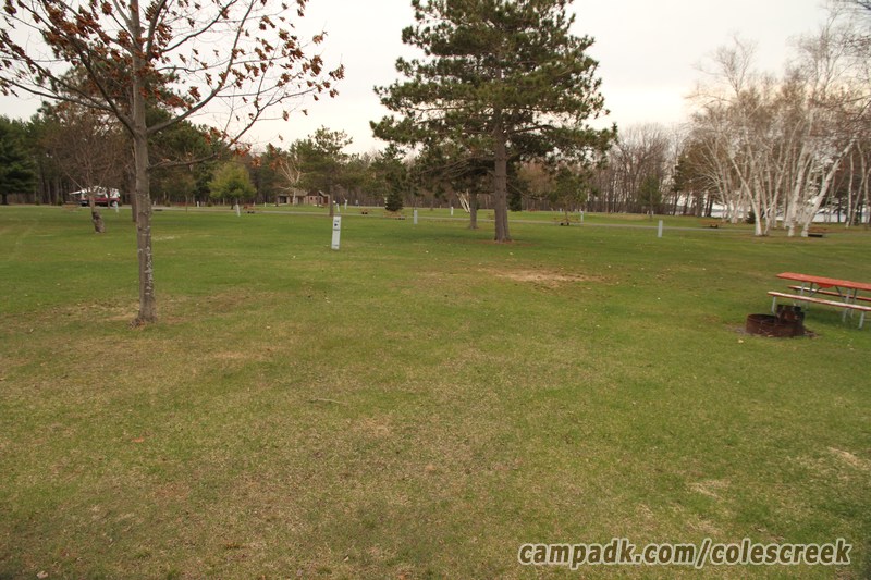Campsite Photo of Site 108 at Coles Creek State Park, New York - Looking at Site from Road Sign Visible