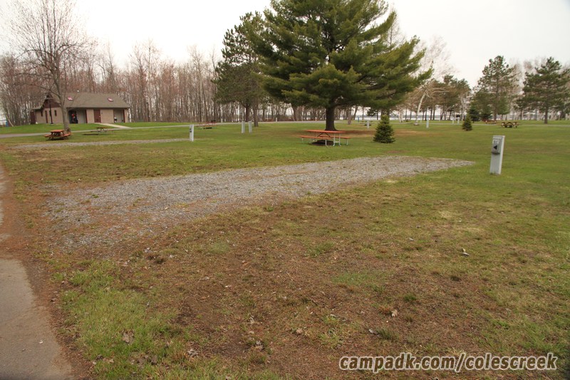 Campsite Photo of Site 61 at Coles Creek State Park, New York - Looking at Site from Road Sign Visible