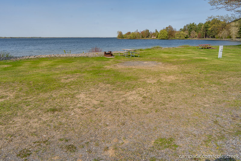 Campsite Photo of Site 117 at Coles Creek State Park, New York - Looking at Site from Road Sign Visible