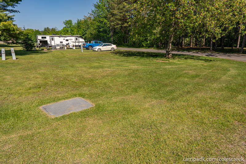 Campsite Photo of Site 63 at Coles Creek State Park, New York - Looking at Site from Road Sign Visible