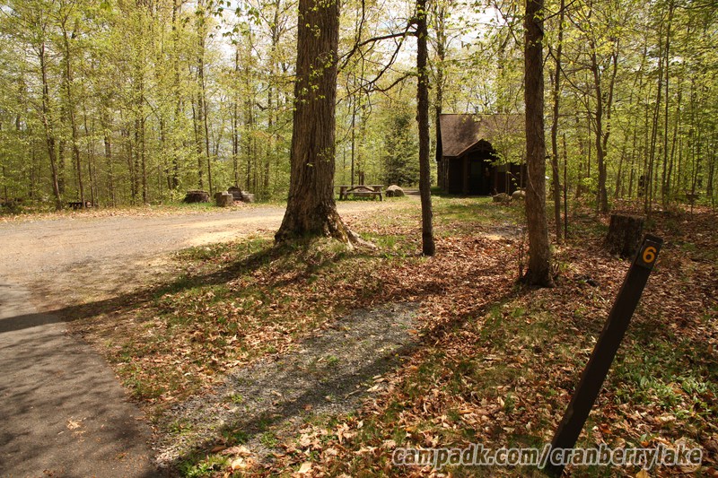 Campsite Photo of Site 6 at Cranberry Lake Campground, New York - Looking at Site from Road Sign Visible
