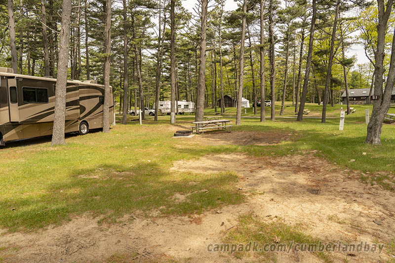 Campsite Photo of Site 51 at Cumberland Bay State Park, New York - Looking at Site from Road Sign Visible