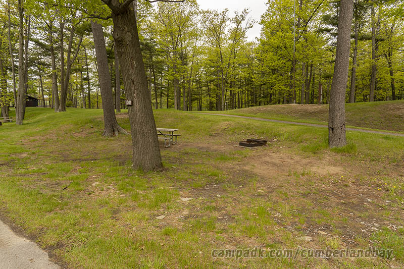 Campsite Photo of Site 108 at Cumberland Bay State Park, New York - Looking at Site from Road Sign Visible