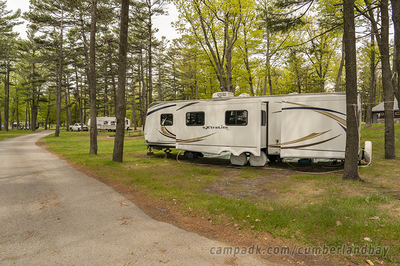Campsite Photo of Site 61 at Cumberland Bay State Park, New York - Looking at Site from Road Sign Visible