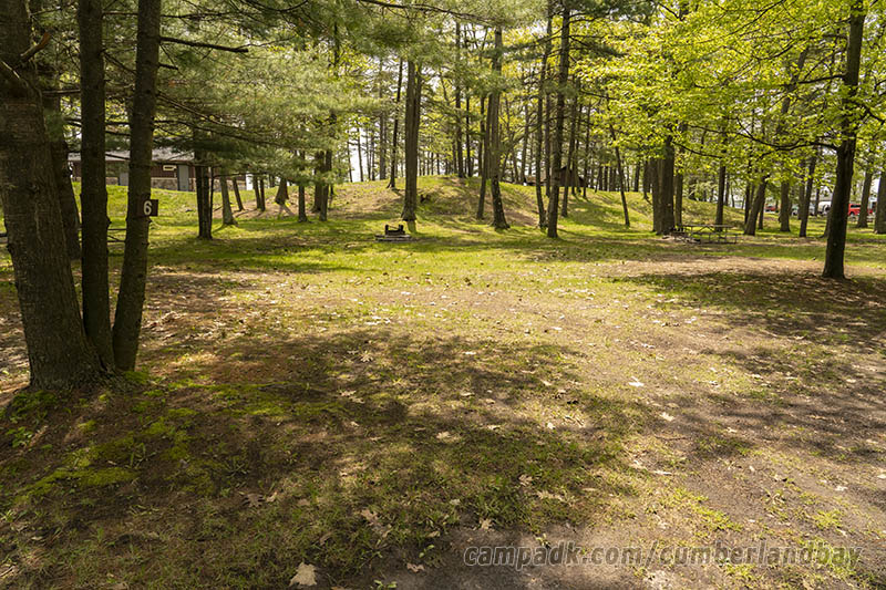 Campsite Photo of Site 6 at Cumberland Bay State Park, New York - Looking at Site from Road Sign Visible