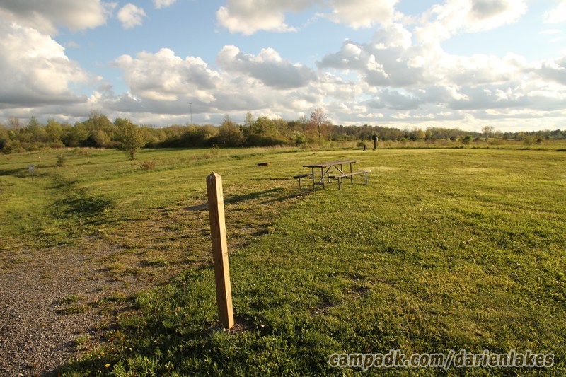 Campsite Photo of Site 50 at Darien Lakes State Park, New York - Looking at Site from Road Sign Visible