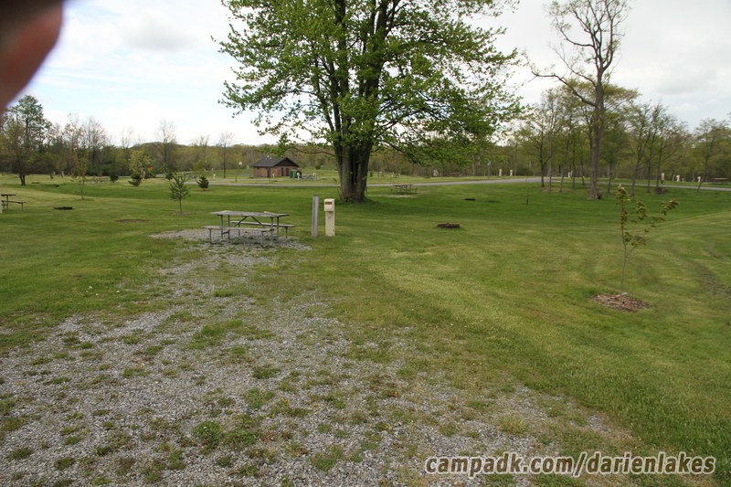 Campsite Photo of Site 121 at Darien Lakes State Park, New York - Looking at Site from Road Sign Visible
