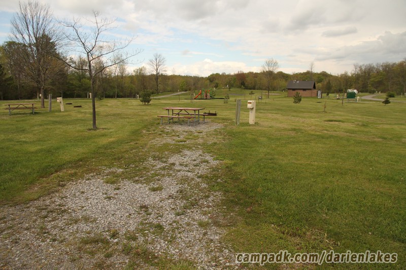 Campsite Photo of Site 111 at Darien Lakes State Park, New York - Looking at Site from Road Sign Visible