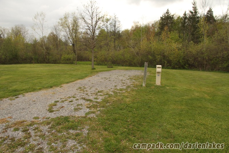 Campsite Photo of Site 106 at Darien Lakes State Park, New York - Looking at Site from Road Sign Visible