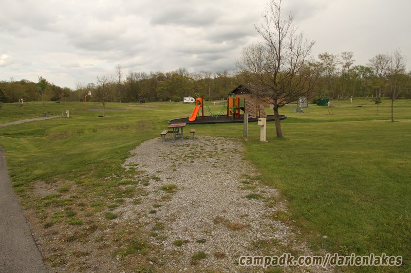 Campsite Photo of Site 101 at Darien Lakes State Park, New York - Looking at Site from Road Sign Visible